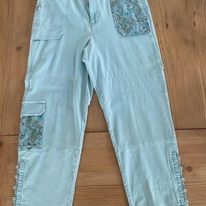 NWOT Anthropologie pants with floral embellishments. Size 12